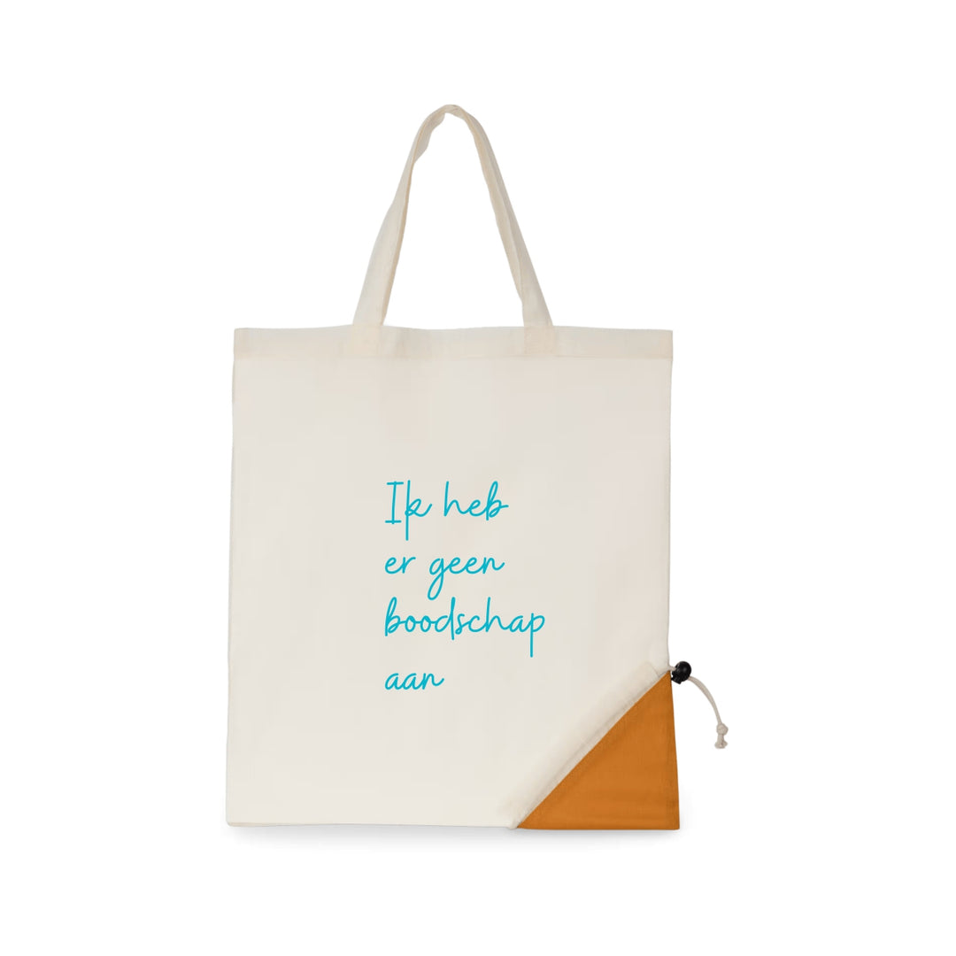 Opvouwbare boodschappentas met tekst Ik heb er geen boodschap aan, biologisch katoen GOTS, OEKO-TEX en vegan, naturel met opbergzakje