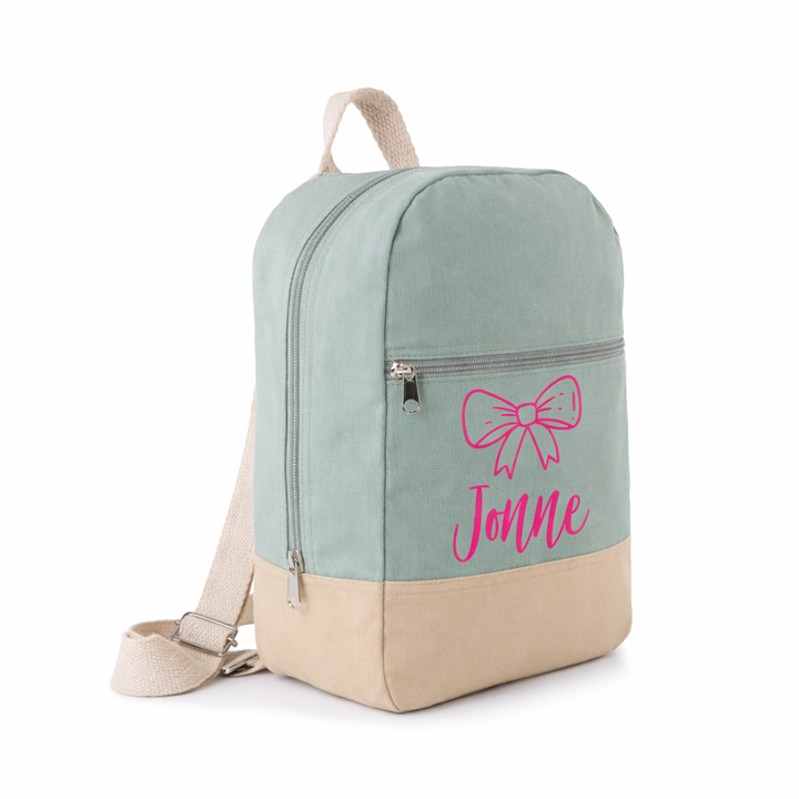 sage groene katoenen rugzak met naam Jonne en roze strik icoon, gepersonaliseerde schooltas voor peuter en kleuter met rits en voorvak